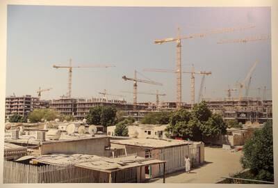 Construction of City Walk takes place behind Shabia Al Difa'a in September 2014