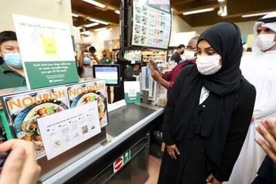 Signs at Spinneys on Abu Dhabi's Muroor Road inform the public that from June 1, 2022, shops cannot stock single-use plastic bags.