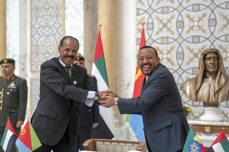 Ethiopian Prime Minister Abiy Ahmed and Eritrean President Isaias Afwerki shake hands at the presidential palace in Abu Dhabi. Crown Prince Court - Abu Dhabi 