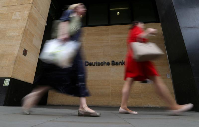 FILE PHOTO: People walk past a Deutsche Bank office in London, Britain, July 8, 2019. REUTERS/Simon Dawson/File Photo