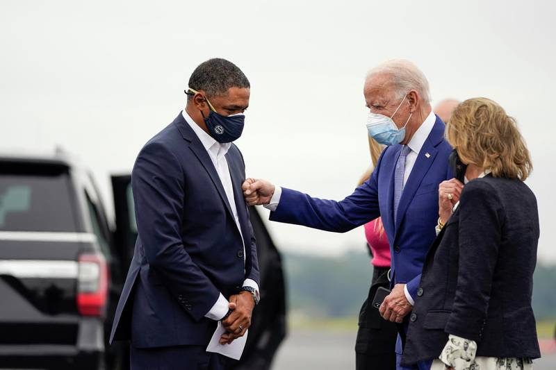 COLUMBUS, GA - OCTOBER 27: (L-R) Rep. Cedric Richmond (D-LA) and Democratic presidential nominee Joe Biden greet each other as Biden arrives at Columbus Airport on October 27, 2020 in Columbus, Georgia. Biden is campaigning in Georgia on Tuesday, with scheduled stops in Atlanta and Warm Springs.   Drew Angerer/Getty Images/AFP