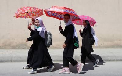 Schoolgirls on their way home in Kabul. EPA