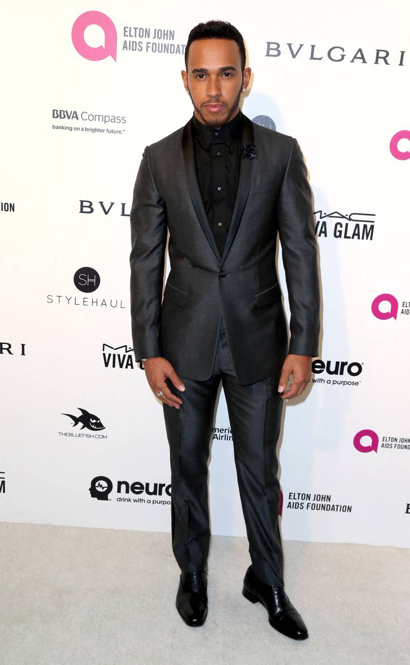 Lewis Hamilton, in a grey suit with Max Verre shoes, attends the 24th Annual Elton John Aids Foundation's Oscar Viewing Party on February 28, 2016, in West Hollywood, California. AFP