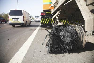 All that was left of a tyre on a military truck transporting refrigerated goods after it blew on the E11 between Dubai and Abu Dhabi. Lee Hoagland / The National 