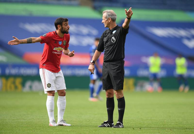 Manchester United's Bruno Fernandes remonstrates with referee Martin Atkinson. Reuters