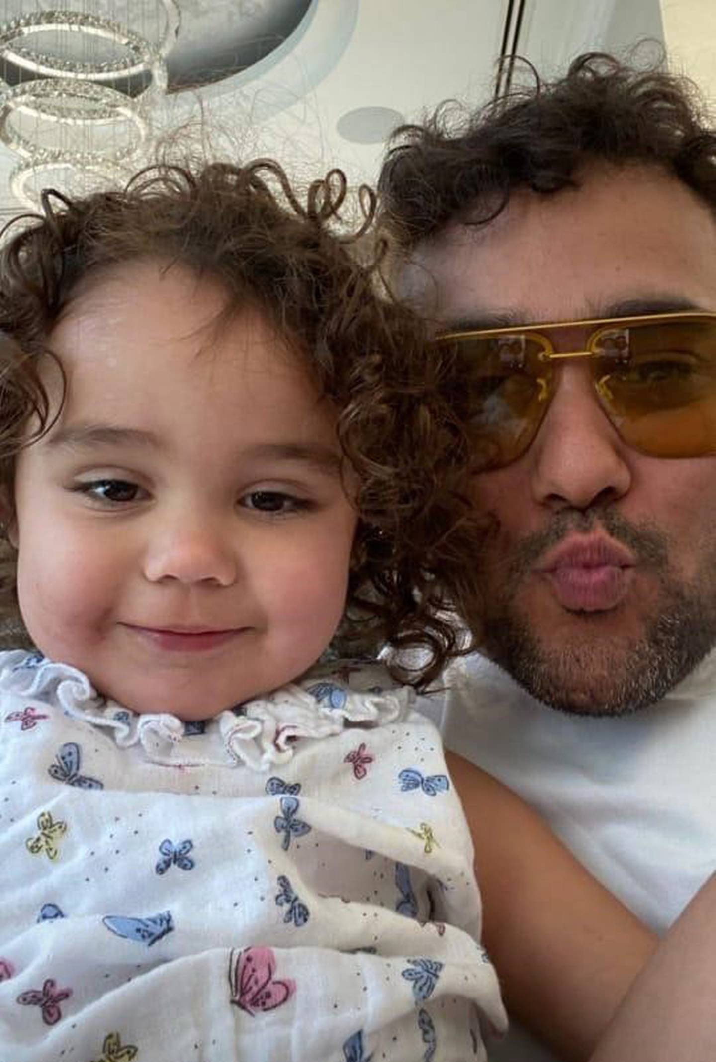 Dubai-based Tobias White-Sansom, 35, with his youngest daughter Poppy. Photo: Maximillian White