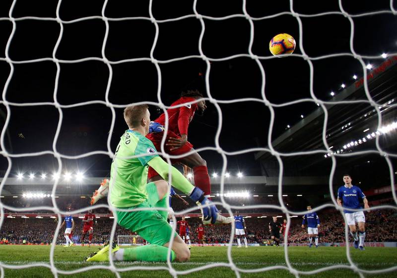 Soccer Football - Premier League - Liverpool v Everton - Anfield, Liverpool, Britain - December 2, 2018  Liverpool's Divock Origi scores their first goal    REUTERS/Phil Noble  EDITORIAL USE ONLY. No use with unauthorized audio, video, data, fixture lists, club/league logos or "live" services. Online in-match use limited to 75 images, no video emulation. No use in betting, games or single club/league/player publications.  Please contact your account representative for further details.