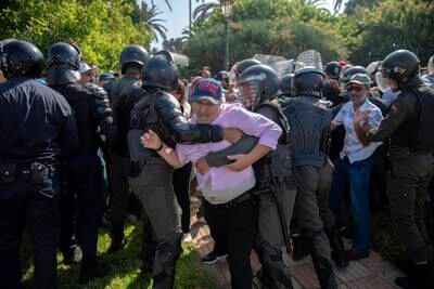 Workers clash with police as they protest over the statute for national education sector employees in Rabat, Morocco, on World Teachers' Day. EPA