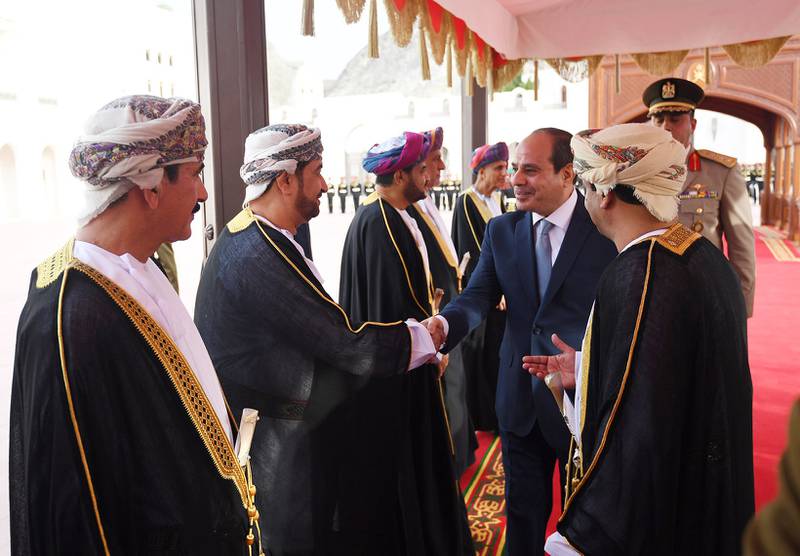 Mr El Sisi greets Omani officials.