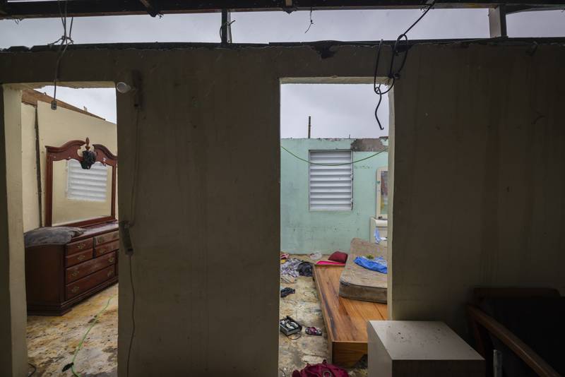 A roof was ripped off this home in Loiza, Puerto Rico. AP