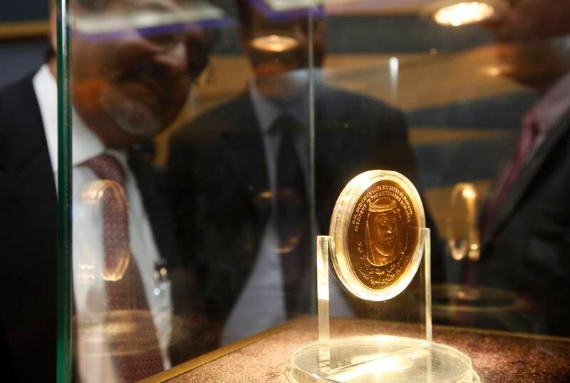 Dubai, 15th August 2011.  The new gold bullion coin with HH President Khalifa Bin Zayed Al Nahyan portrait which measures approximately 3 inches, as people get a glimpse of it, during the unveiling ceremony.  (Jeffrey E Biteng / The National)