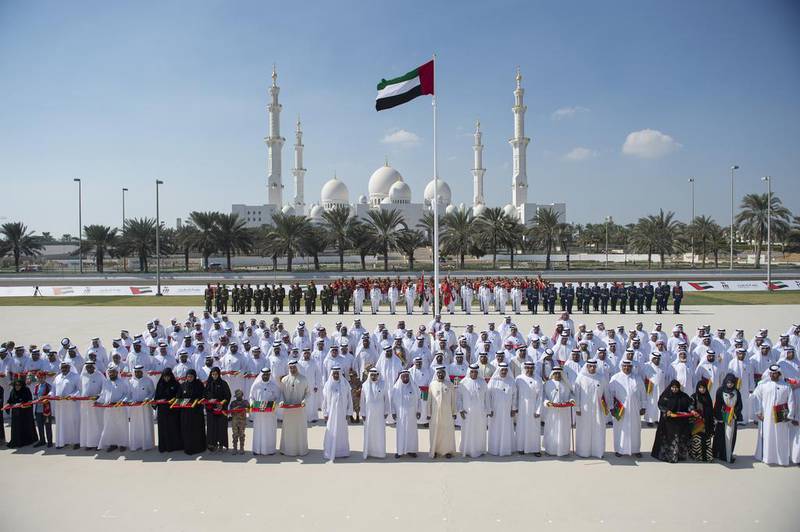 Sheikh Mohammed bin Rashid, Vice President and Ruler of Dubai, along with Sheikh Mohammed bin Zayed, Crown Prince of Abu Dhabi and Deputy Supreme Commander of the Armed Forces, Sheikh Saud bin Saqr Al Qasimi, Ruler of Ras Al Khaimah, Sheikh Hamad bin Mohammed Al Sharqi, Ruler of Fujairah, Sheikh Saud bin Rashid Al Mualla, Ruler of Umm Al Quwain, Dr Sheikh Sultan bin Mohammed Al Qasimi, Ruler of Sharjah, and the families of the fallen, during the inaugural Commemoration Day ceremony in Abu Dhabi. Rashed Al Mansoori / Crown Prince Court – Abu Dhabi