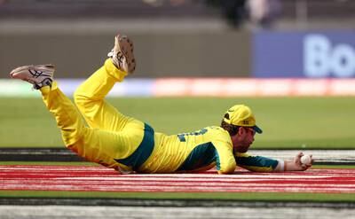 Australia's Travis Head takes the catch to dismiss India's Rohit Sharma, off the bowling of Glenn Maxwell. Reuters
