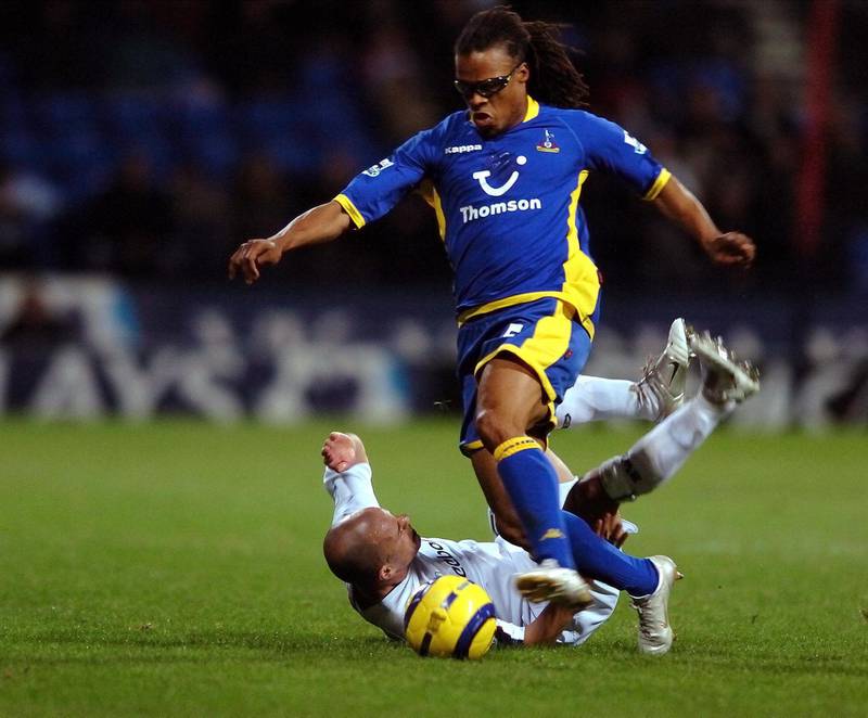 Tottenham Hotspur's,  Edgar Davids (standing) avoids the tackle of Bolton Wanderers' Stelios during Bolton's 1-0 win over Tottenham Hotspur  in the English Premiership match at the Reebok Stadium in Bolton, 07 November 2005.
AFP PHOTO/GLENN CAMPBELL

Mobile and website use of domestic English football pictures subject to subscription of a license with Football Association Premier League (FAPL) tel : +44 207 298 1656. For newspapers where the football content of the printed and electronic versions are identical, no licence is necessary. (Photo by GLENN CAMPBELL / AFP)