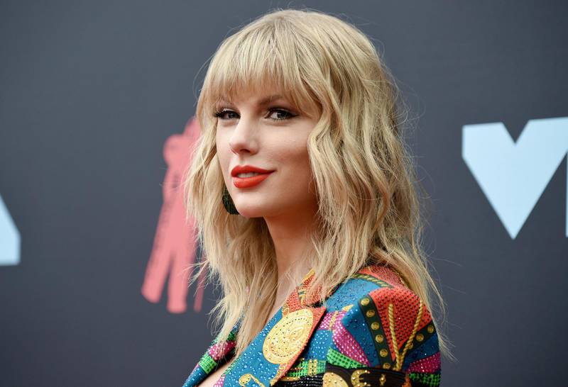 FILE - Singer-songwriter Taylor Swift arrives at the MTV Video Music Awards in Newark, N.J. on Aug. 26, 2019. Swift was nominated for four American Music Awards on Monday, Oct. 26. She has the chance to extend her lead as the most awarded artist in AMA history. She already has 29 wins. The AMAs will air on Nov. 22 on ABC. (Photo by Evan Agostini/Invision/AP, File)