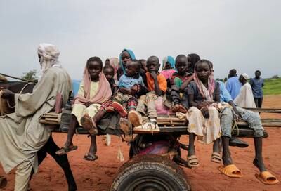 Sudanese children cross the border into Chad in early August. Reuters
