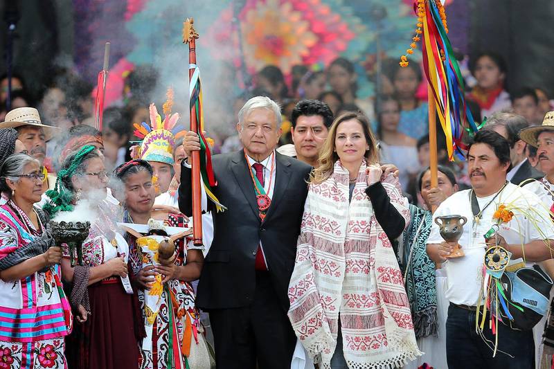 President of Mexico AndrÃ©s Manuel Lopez Obrador announced that he tested positive for COVID-19. Has developed mild symptoms and is under medical treatment. MEXICO CITY, MEXICO - DECEMBER 01: Andres Manuel Lopez Obrador (L), President of Mexico poses with the baton alongside his wife Beatriz Gutierrez during the events of the Presidential Investiture as part of the 65th Mexico Presidential Inauguration at Zocalo on December 01, 2018 in Mexico City, Mexico. (Photo by Manuel Velasquez/Getty Images)