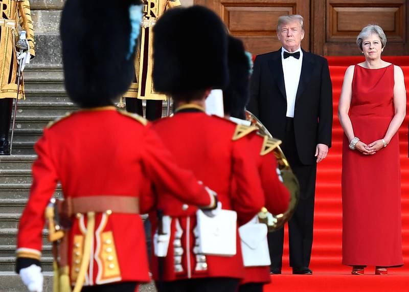 Donald Trump and Theresa May watch a military performance by the bands of the Scots, Irish and Welsh Guards. Bloomberg