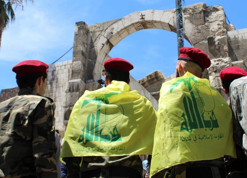 Palestinians living in Syria, wearing Hezbollah flags, take part in a demonstration marking the annual Quds Day, or Jerusalem Day, during the holy month of Ramadan in Damascus, Syria May 7, 2021.  REUTERS/Firas Makdesi