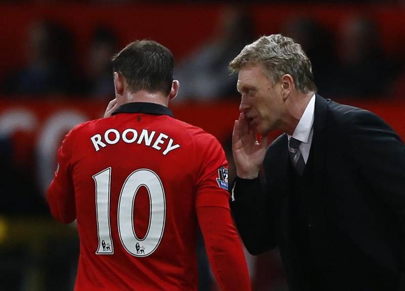 Wayne Rooney, left, was unhappy at Old Trafford last season but the striker is now settled once again, and he hands much of the credit for that to Manchester United manager David Moyes. REUTERS/Darren Staples