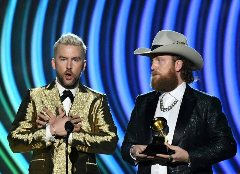 The Brothers Osborne accept the trophy for Best Country Duo Performance during the the 64th Annual Grammy Awards pre-telecast show in Las Vegas. AFP