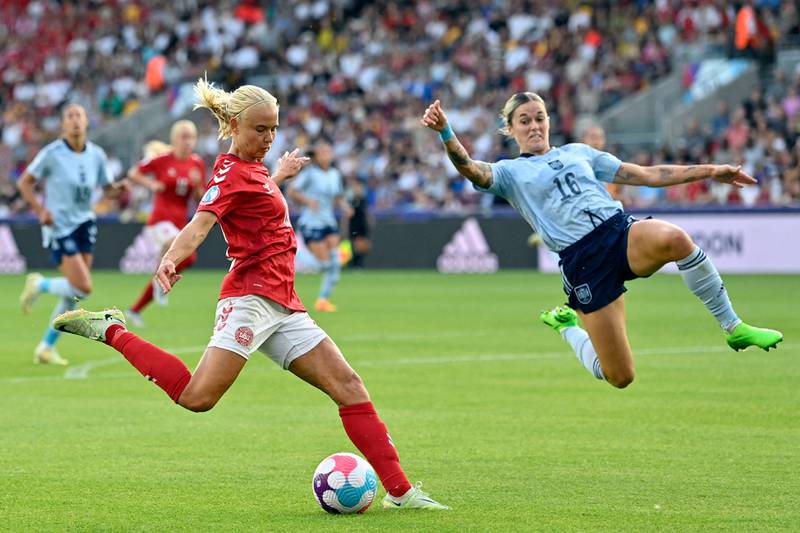 Denmark's striker Pernille Harder, left, is challenged by Spain's defender Maria Leon during the UEFA Women's Euro 2022 Group B football match at Brentford Stadium in west London. AFP