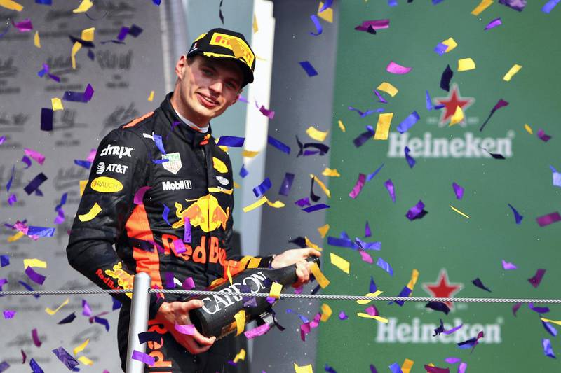 MEXICO CITY, MEXICO - OCTOBER 29: Race winner Max Verstappen of Netherlands and Red Bull Racing celebrates on the podium during the Formula One Grand Prix of Mexico at Autodromo Hermanos Rodriguez on October 29, 2017 in Mexico City, Mexico.   Clive Mason/Getty Images/AFP