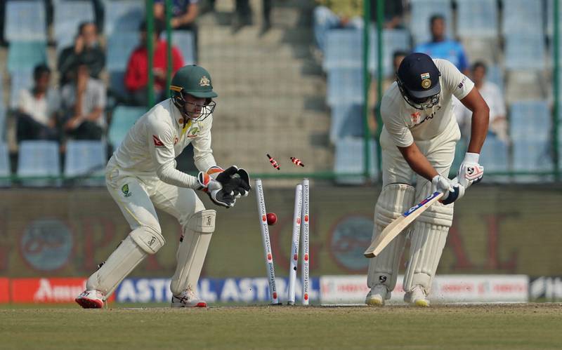 India's Rohit Sharma is bowled by Australia's Nathan Lyon. Reuters