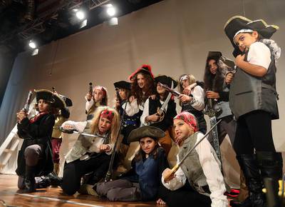 Schoolchildren representing various characters of Treasure Island during a dress rehearsal in Dubai. Satish Kumar / The National 