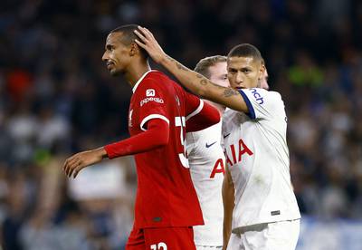 Liverpool's Joel Matip is consoled by Tottenham Hotspur's Richarlison. Reuters