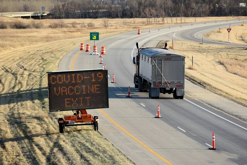 A sign in Canada directs a lorry driver to a Covid-19 vaccine facility. A new coronavirus 'sniffing' device could significantly reduce the impact of the current and future pandemics, developers say. Reuters