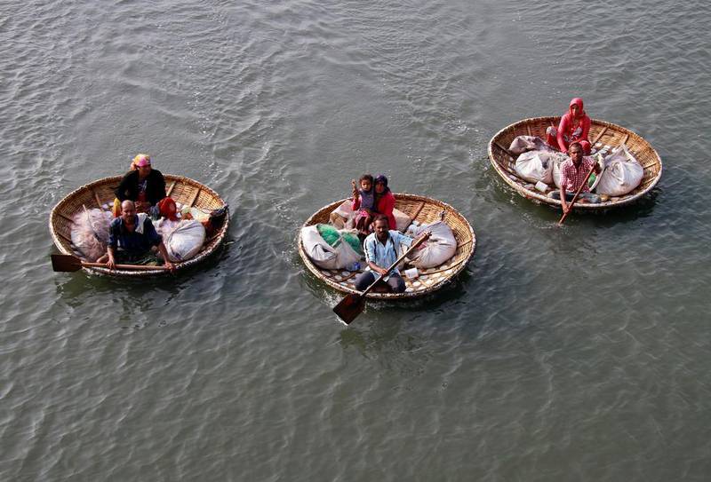 Fishermen on Vembanad Lake in Kochi, India. Sivaram V / Reuters