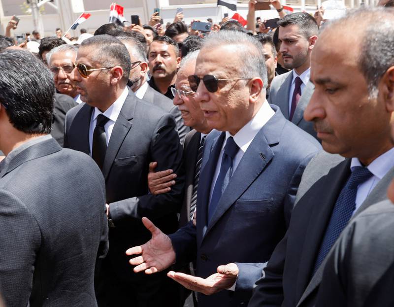 Iraqi Prime Minister Mustafa Al Kadhimi attends the funeral of Iraqi poet Muthaffar Al Nawab in Baghdad, Iraq. Reuters
