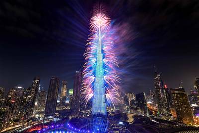 Fireworks light up the sky by the landmark Burj Khalifa skyscraper. Ryan Lim / AFP