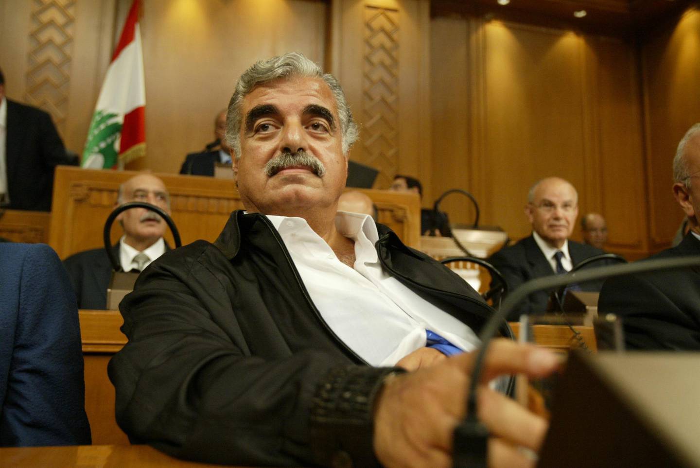 (FILES) In this file photo taken on September 3, 2004 Lebanese Prime Minister Rafiq Hariri attends a parliamentary session in Beirut. - The trial of four Hezbollah suspects in the assassination of Lebanese ex-prime minister Rafiq Hariri, killed in 2005, enters the final stretch on September 11, 2018 in a special UN-backed court in the Netherlands, with closing arguments in the long-running case. (Photo by Joseph BARRAK / AFP)