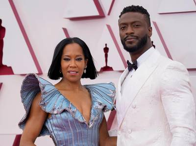 Regina King and Aldis Hodge arrive to the Oscars red carpet for the 93rd Academy Awards in Los Angeles, California, US, April 25, 2021. Reuters