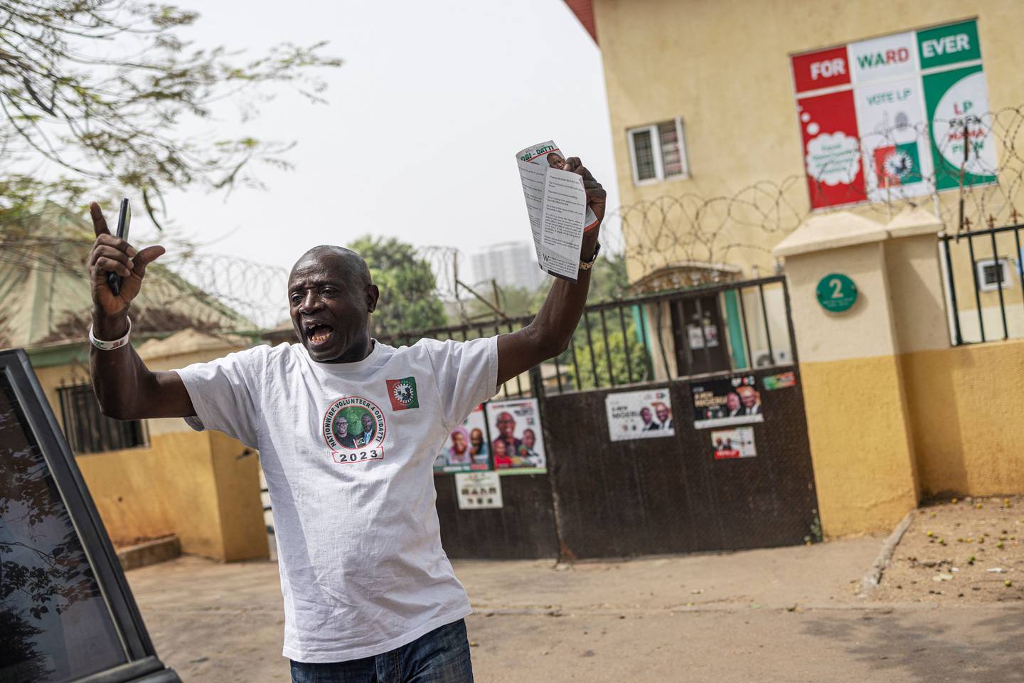 A man chants political slogans outside Labour Party candidate Peter Obi's offices in Abuja. AFP