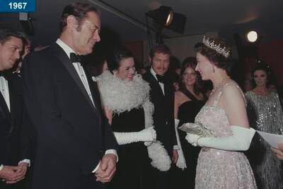 1967: The queen meets actor Rex Harrison and his wife Rachel Roberts at the premiere of the film 'Dr Dolittle' at the Odeon Marble Arch, London.