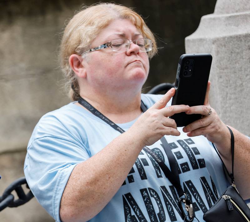 Catina Carter wears a T-shirt reading '#FreeAdnan' outside the courthouse. Reuters