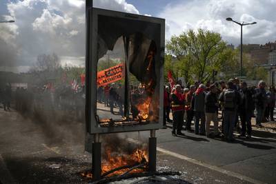 Protesters match during a demonstration in Lyon, central France. AP