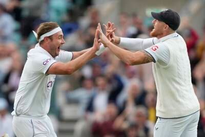 England's Stuart Broad and Ben Stokes celebrate the dismissal of Australia's Todd Murphy. AP 