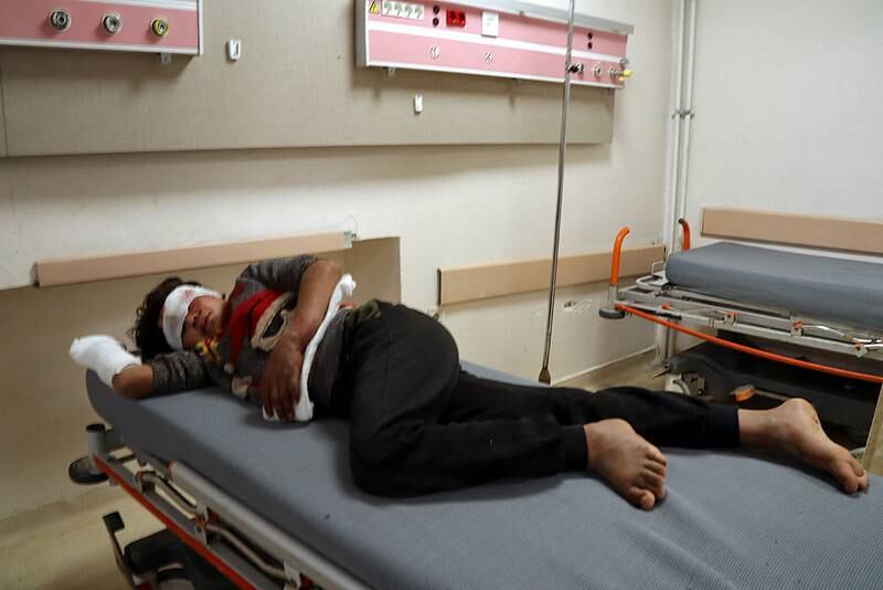 A person wounded in a rocket attack in the town of Azaz receives medical care at a clinic. AFP