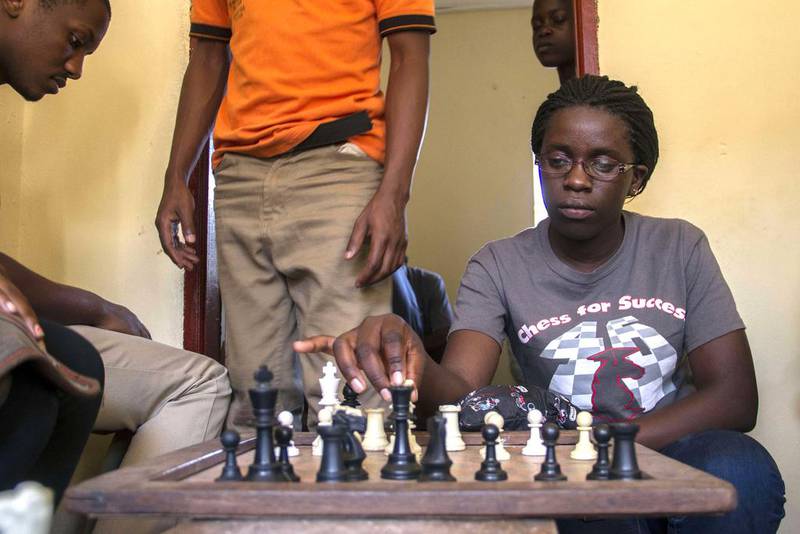 Phiona Mutesi plays a game of chess with her colleagues at the chess academy in Kibuye, Kampala in January. Isaac Kasamani / AFP 