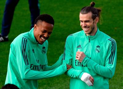 Gareth Bale and Brazilian defender Eder Militao share a joke. AFP
