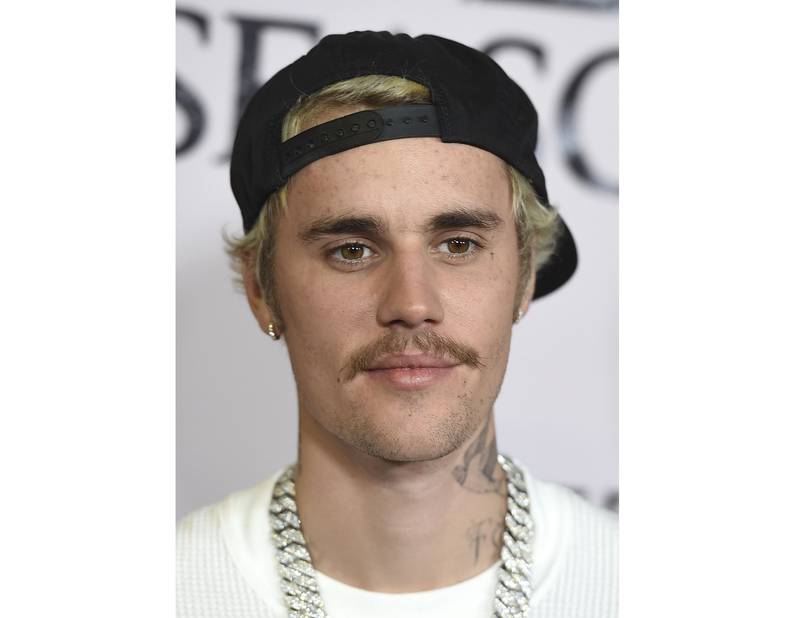 In a white tee and chunky chain for the premiere of 'Justin Bieber: Seasons' in Los Angeles, California, on January 27, 2020. Invision / AP