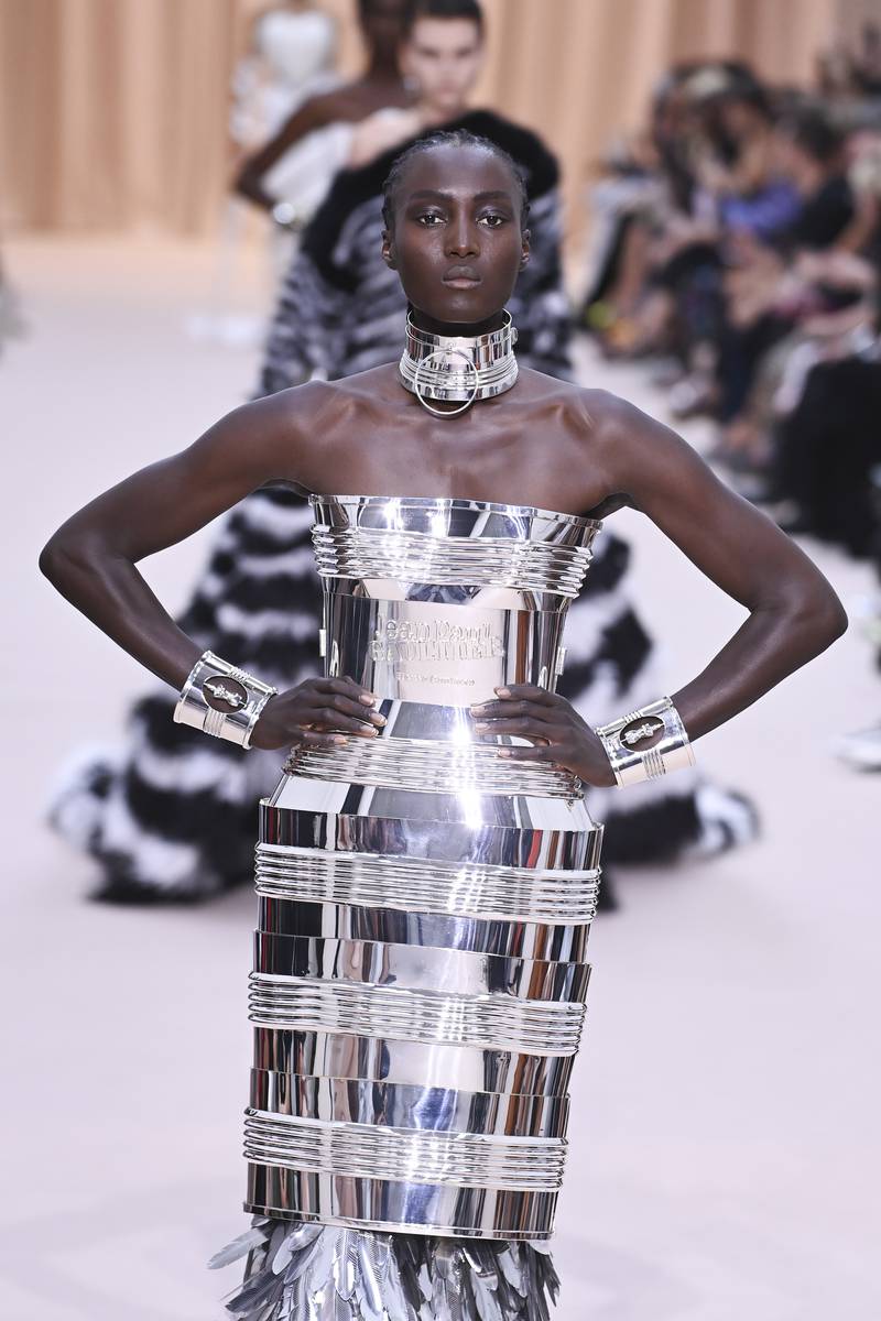 A dress made to resemble the famous perfume tin can packaging at Jean Paul Gaultier. Getty Images