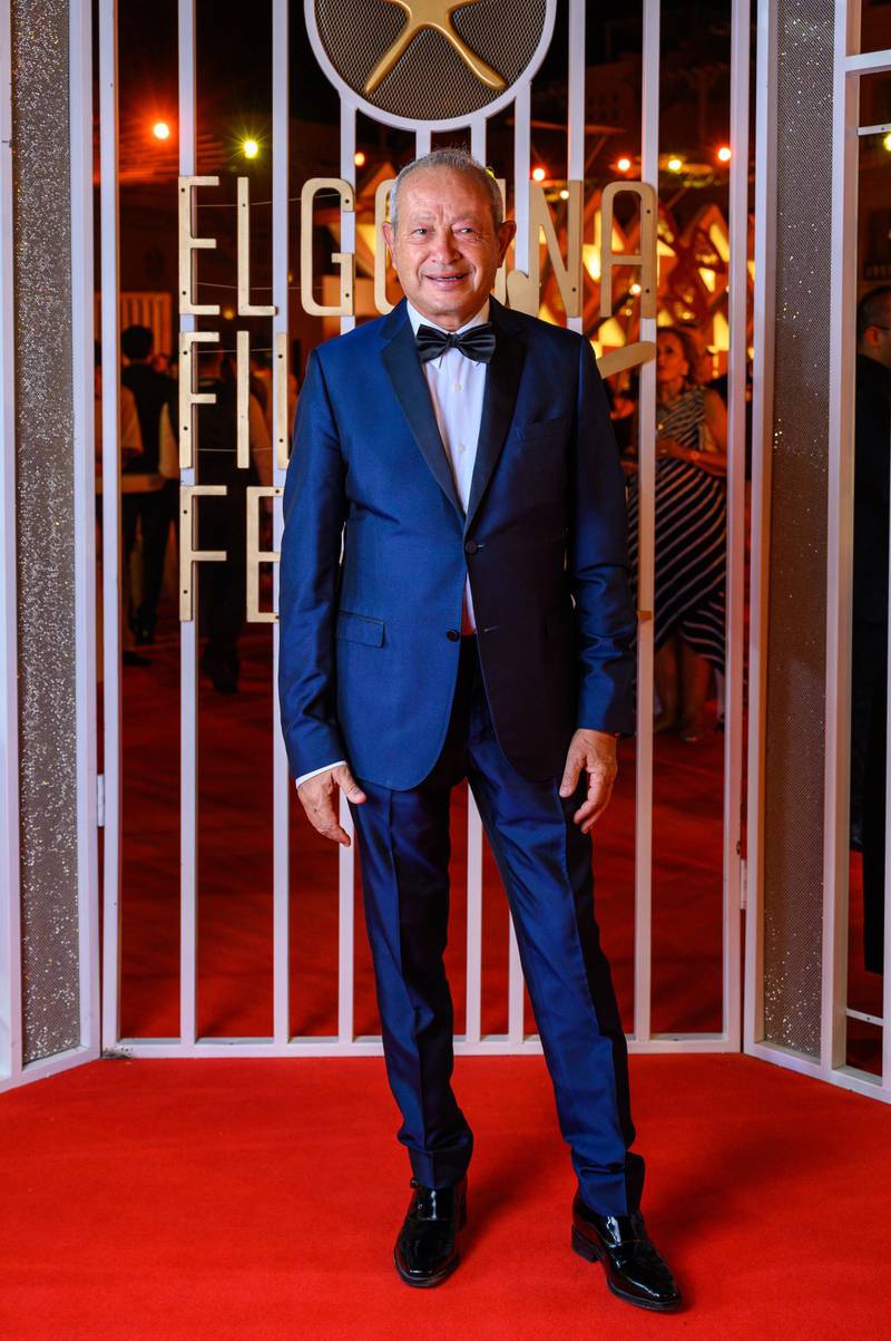 Egyptian businessman Naguib Sawiris poses on the red carpet during the closing ceremony of the El Gouna Film Festival. AFP