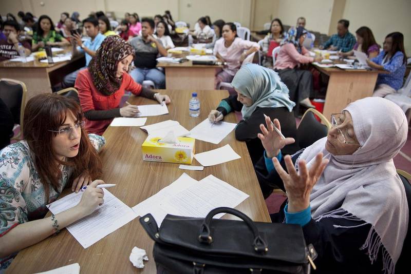 Teachers take part in a workshop in Abu Dhabi. A survey has shown that mandatory training for public school teachers across the country is often repetitive, irrelevant or conducted by unqualified instructors. Silvia Razgova / The National