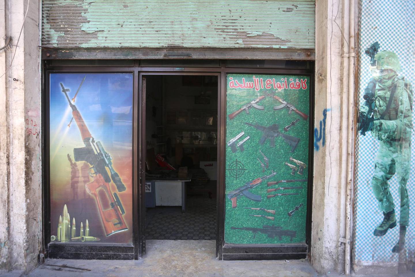 The exterior of a gun shop in Idlib. The National