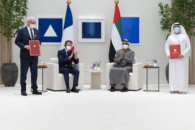 Sheikh Mohamed and Mr Macron with Mohammed Al Hammadi, chief executive of Emirates Nuclear Energy Company, right, and Bruno Le Maire, Minister of the Economy, Finance and Recovery of France. Photo: Ministry of Presidential Affairs